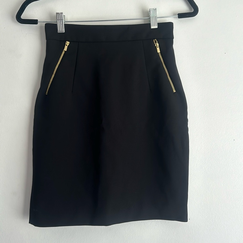 black pencil skirt with gold zippers
